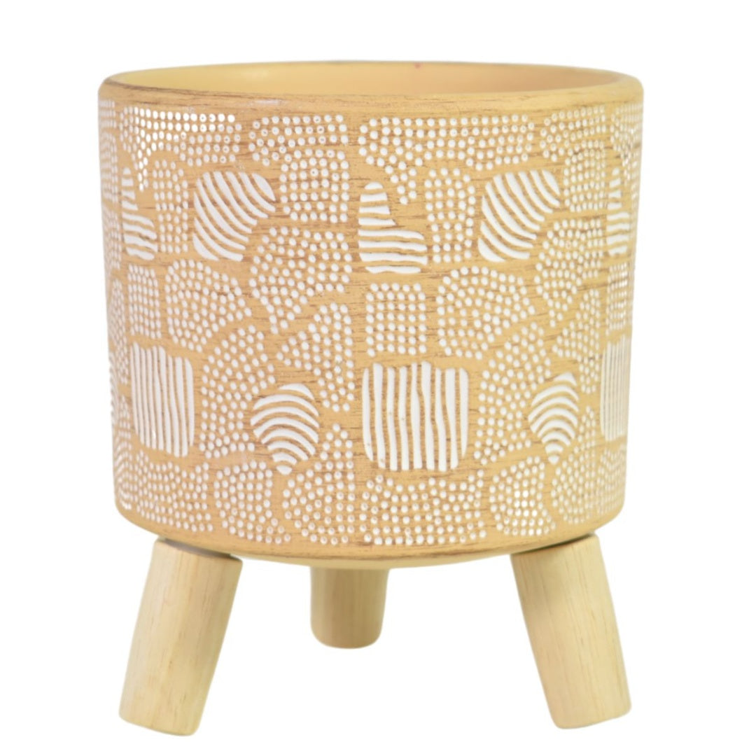 Maceta de cerámica con patas de madera. Beige