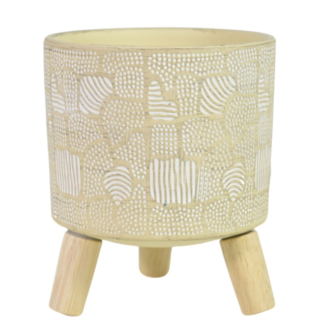 Maceta de cerámica con patas de madera. Beige